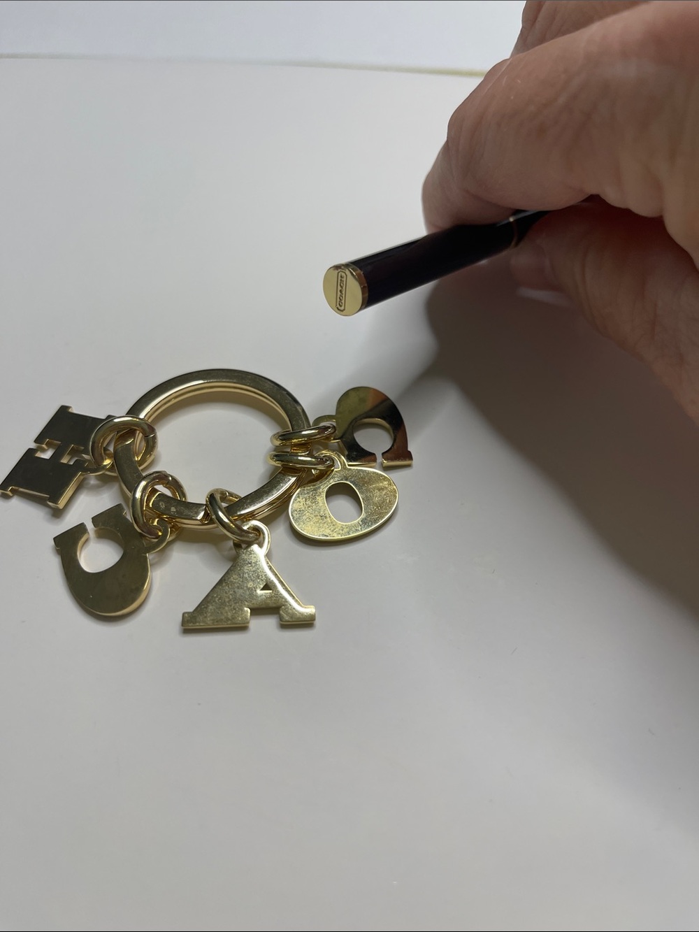 (2) COACH Black and Gold Charm Keyring and (2) hot pink Coach Pens - Picture 5 of 8